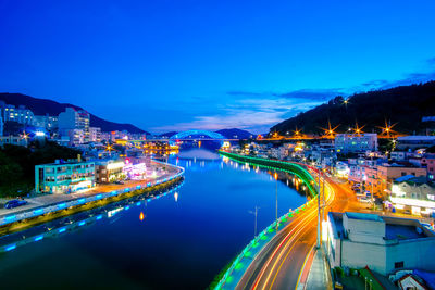 High angle view of light trails in city at night