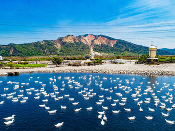 Scenic view of mountains against blue sky