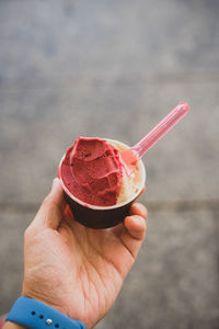 Close-up of hand holding ice cream