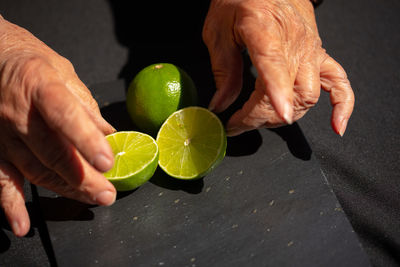 Midsection of man holding fruits