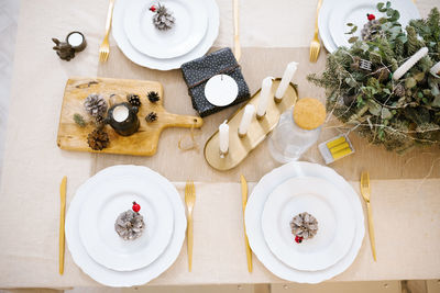 Christmas decorated table for dinner with a beautiful setting