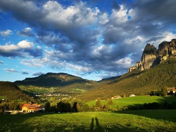 Scenic view of landscape and mountains against sky