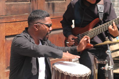 Man playing guitar at music concert