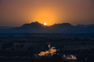 Scenic view of mountains against sky during sunset