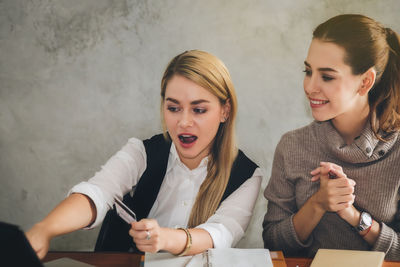 Two people working in a room