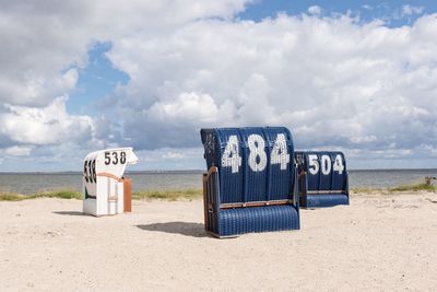 Lifeguard hut on beach against sky