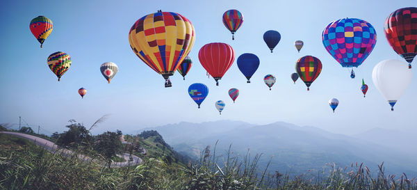 Low angle view of hot air balloons against sky