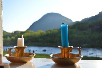 Close-up of candles on table