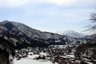 High angle view of snowcapped mountains against sky