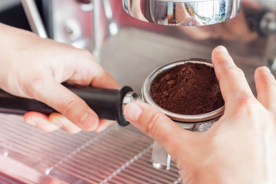 Cropped hands holding coffee