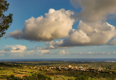 Scenic view of sea and buildings against sky