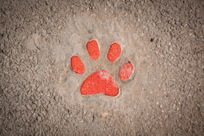 High angle view of heart shape on sand