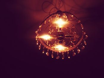 Close-up of illuminated light bulb