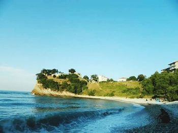 Scenic view of sea against blue sky