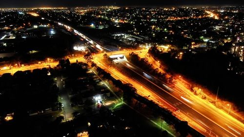 High angle view of illuminated cityscape at night