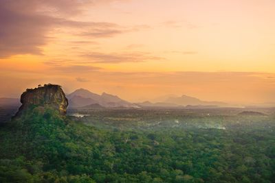 Scenic view of mountain against cloudy sky