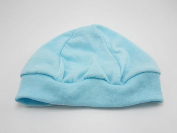 High angle view of hat against white background