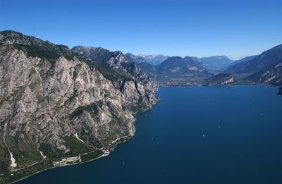 Scenic view of mountains against clear blue sky