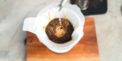 High angle view of coffee cup on table