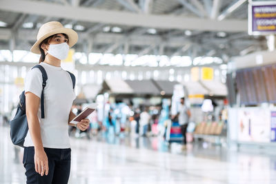 Woman standing on mobile phone