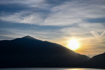 Scenic view of silhouette mountains against sky during sunset