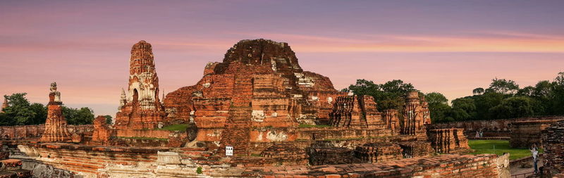 Panoramic view of temple against sky during sunset