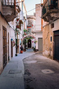 Alley decorated with flowers and plants in the historic center of grottaglie