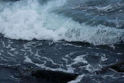 High angle view of waves in sea