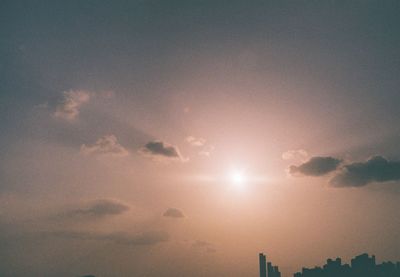 Low angle view of buildings against sky during sunset