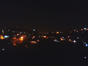 Illuminated cityscape at night