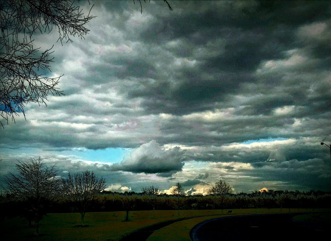 sky, cloud - sky, cloudy, landscape, tranquil scene, weather, tree, tranquility, storm cloud, scenics, overcast, field, cloud, beauty in nature, dramatic sky, nature, cloudscape, atmospheric mood, dusk, idyllic