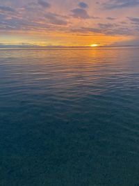 Scenic view of sea against sky at sunset