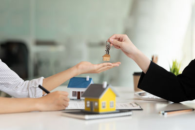 Midsection of business colleagues shaking hands