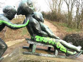 Statue against trees in park