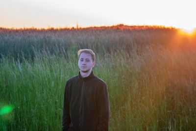 Portrait of a man standing on field