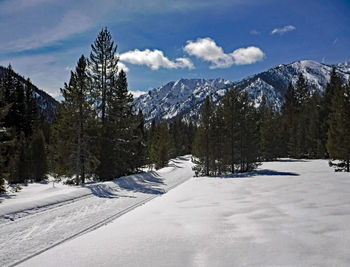 Scenic view of snow covered mountains against sky