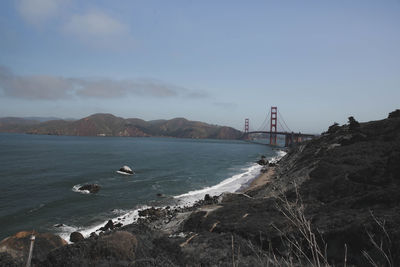 View of suspension bridge over sea