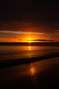 Scenic view of sea against romantic sky at sunset