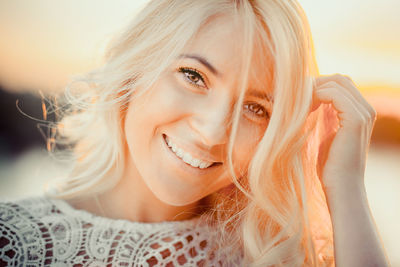 Close-up portrait of a smiling young woman