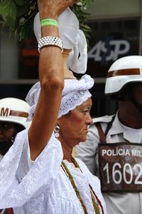 Midsection of woman standing on street
