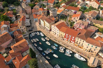 High angle view of houses by canal in city