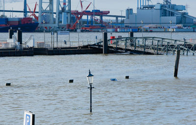 Scenic view of harbor against sky