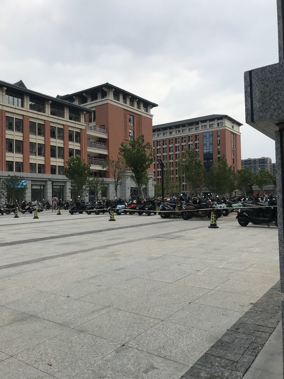 STREET BY BUILDINGS AGAINST SKY