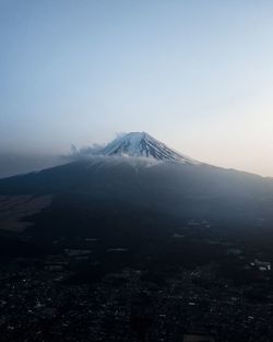 Scenic view of snowcapped mountains against clear sky