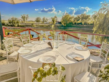 Empty chairs and tables in restaurant