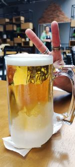 Close-up of beer glass on table