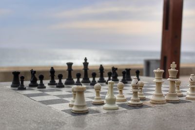 Chess pieces by sea