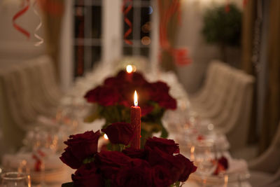 Close-up of lit candles in temple