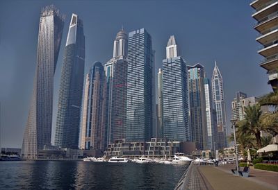 Modern buildings in city against sky