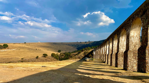 Empty road along countryside landscape